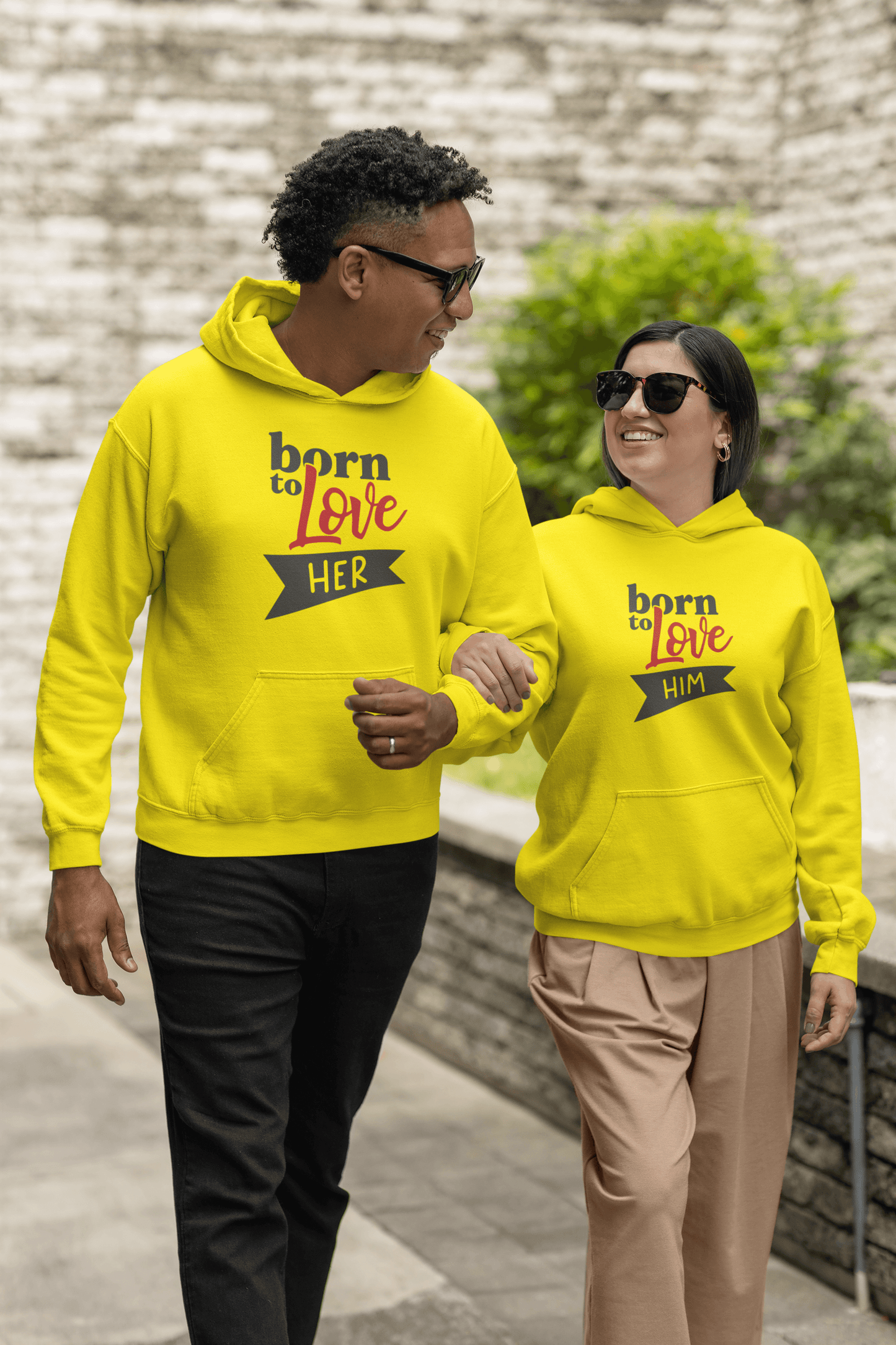 Couple in yellow Born to Love hoodie set, showcasing stylish matching designs for him and her.